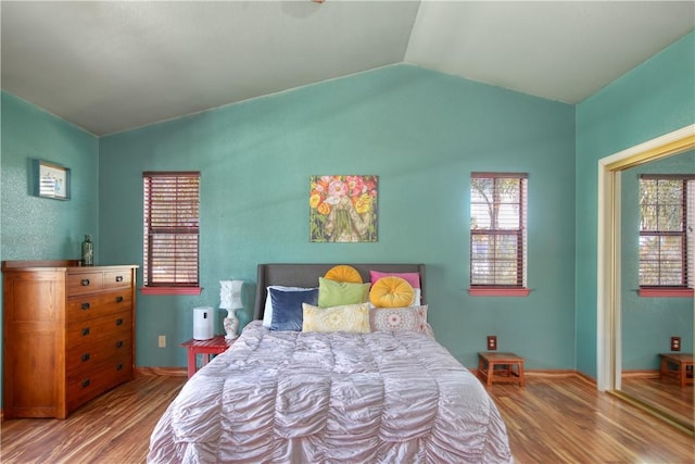 1268 Baden Ave, Grover Beach, CA 93433 - bedroom with vaulted ceiling, wood finished floors, and multiple windows
