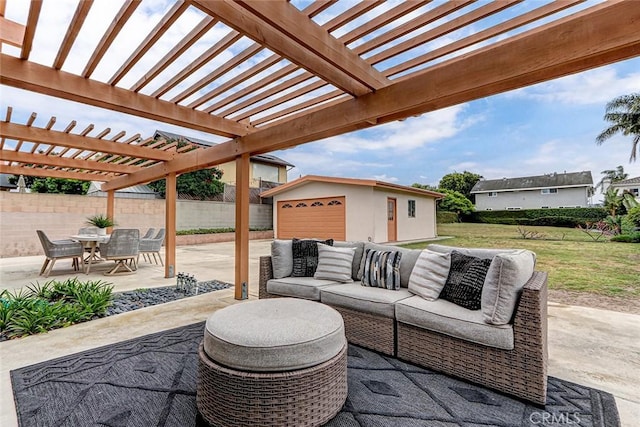 view of patio / terrace with a pergola, outdoor lounge area, an outdoor structure, fence, and a garage