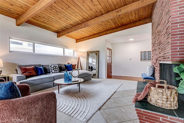 living room with wooden ceiling, beamed ceiling, and a fireplace