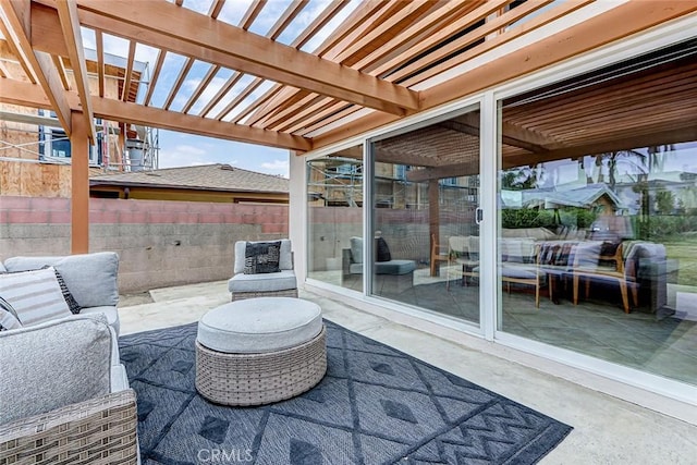 view of patio featuring a pergola and fence