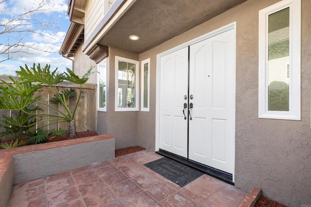 1194 Erin Dr, El Cajon, CA 92020 - view of exterior entry featuring stucco siding and fence