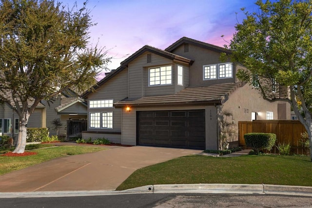 1194 Erin Dr, El Cajon, CA 92020 - view of front of house with fence, a tiled roof, concrete driveway, a front yard, and a garage