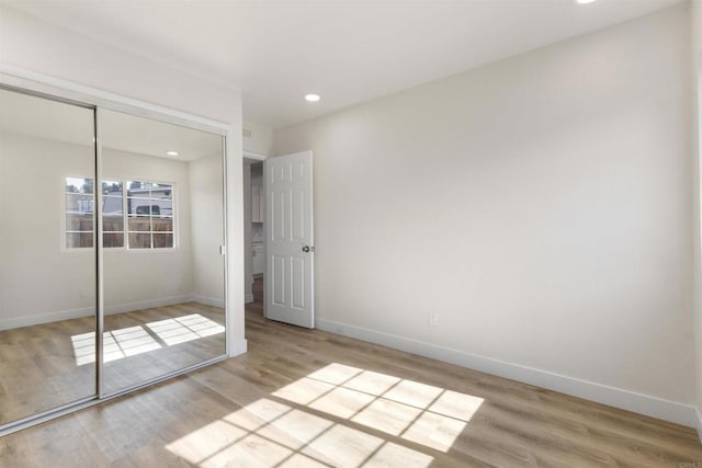 1194 Erin Dr, El Cajon, CA 92020 - unfurnished bedroom with baseboards, wood finished floors, and a closet