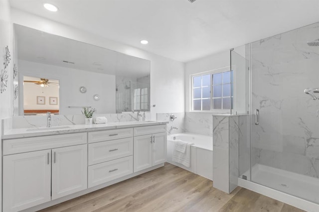 1194 Erin Dr, El Cajon, CA 92020 - bathroom featuring wood finished floors, a sink, a marble finish shower, a bath, and double vanity