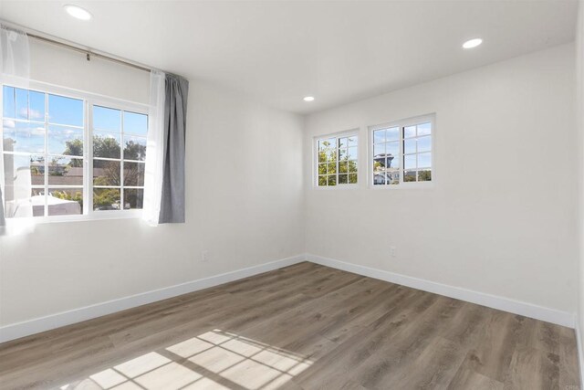1194 Erin Dr, El Cajon, CA 92020 - unfurnished room with recessed lighting, wood finished floors, and baseboards