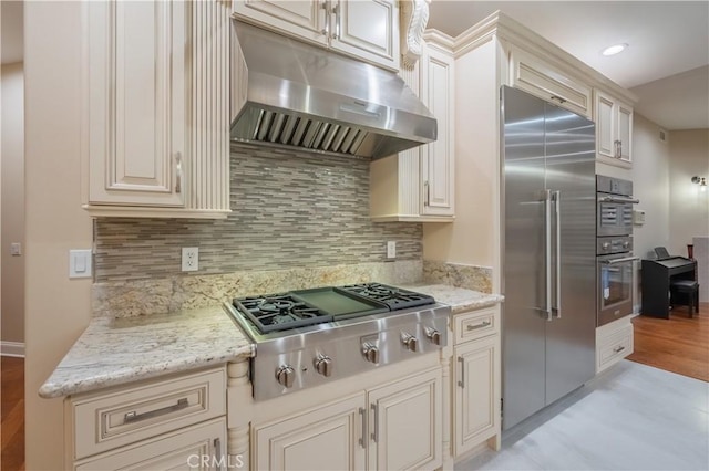 3499 Viewfield Ave, Hacienda Heights, CA 91745 - kitchen featuring light stone countertops, decorative backsplash, appliances with stainless steel finishes, and under cabinet range hood