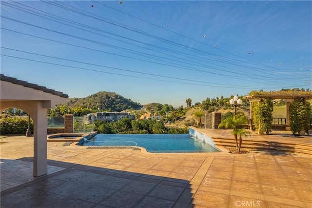 3499 Viewfield Ave, Hacienda Heights, CA 91745 - view of swimming pool with a pool with connected hot tub, a patio, and a mountain view