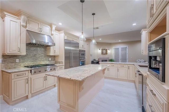 3499 Viewfield Ave, Hacienda Heights, CA 91745 - kitchen featuring a peninsula, visible vents, decorative backsplash, under cabinet range hood, and appliances with stainless steel finishes
