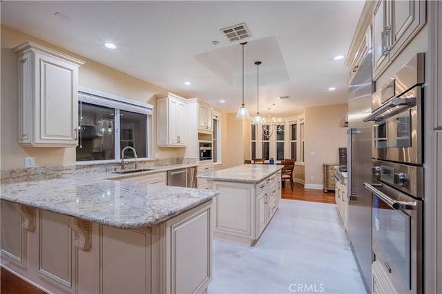 3499 Viewfield Ave, Hacienda Heights, CA 91745 - kitchen featuring dishwasher, visible vents, a sink, a kitchen island, and a peninsula