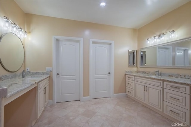 3499 Viewfield Ave, Hacienda Heights, CA 91745 - full bathroom featuring two vanities, baseboards, and a sink