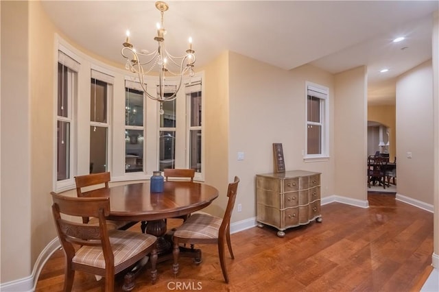 3499 Viewfield Ave, Hacienda Heights, CA 91745 - dining room with arched walkways, baseboards, an inviting chandelier, recessed lighting, and wood finished floors