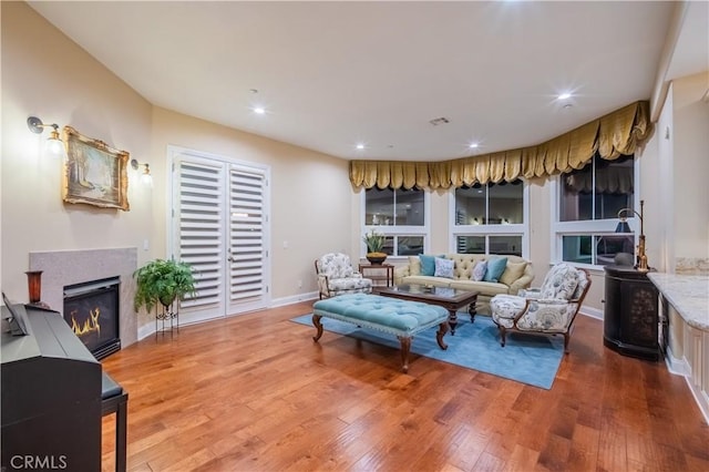 3499 Viewfield Ave, Hacienda Heights, CA 91745 - living room with visible vents, baseboards, a glass covered fireplace, recessed lighting, and wood finished floors