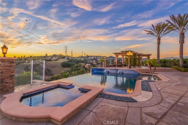 3499 Viewfield Ave, Hacienda Heights, CA 91745 - pool at dusk with a pergola, a patio area, and a pool with connected hot tub