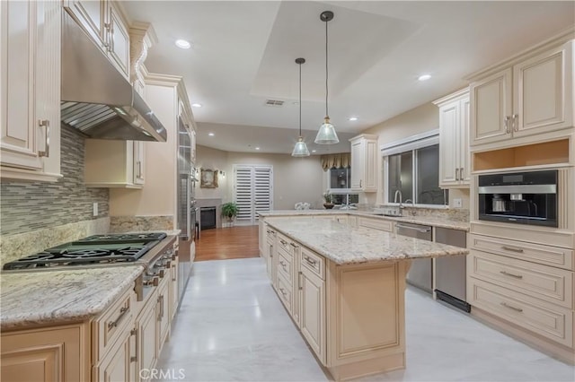 3499 Viewfield Ave, Hacienda Heights, CA 91745 - kitchen featuring tasteful backsplash, stainless steel appliances, cream cabinetry, under cabinet range hood, and light stone countertops