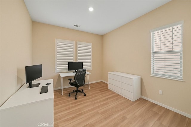 home office with baseboards, visible vents, light wood-style floors, and recessed lighting