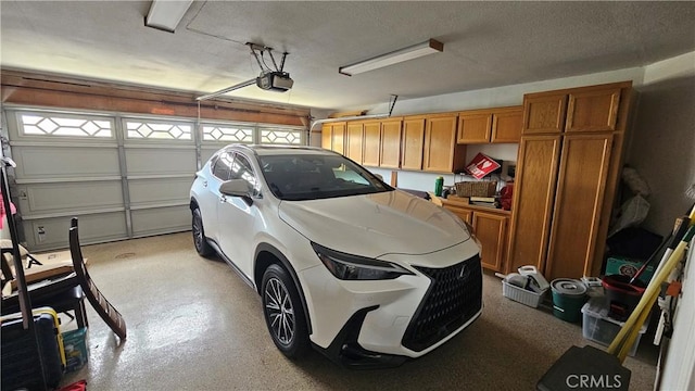 garage featuring a garage door opener