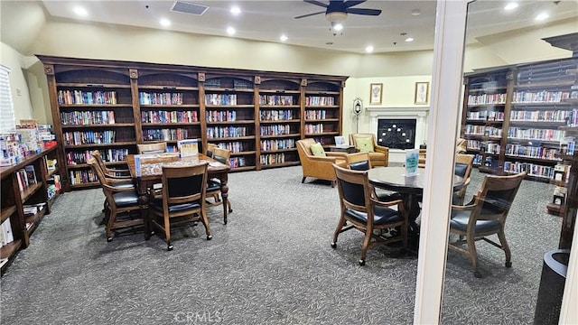carpeted dining area featuring recessed lighting, visible vents, and ceiling fan