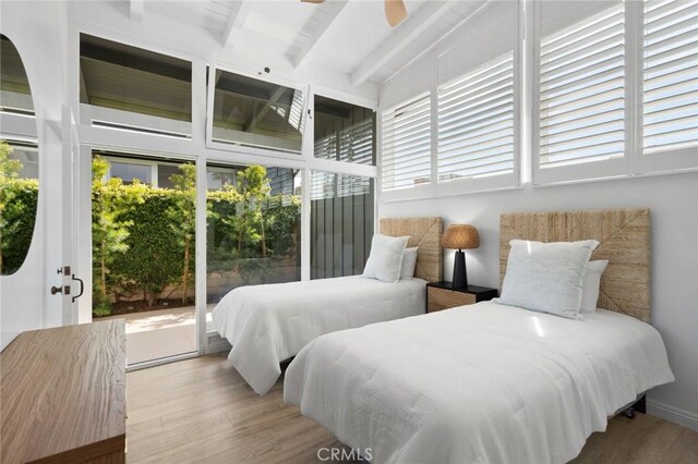 432 Seville Ave, Newport Beach, CA 92661 - bedroom with wood finished floors, beam ceiling, and access to exterior