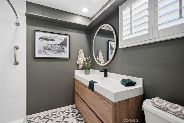 432 Seville Ave, Newport Beach, CA 92661 - bathroom featuring baseboards, toilet, vanity, and tile patterned floors