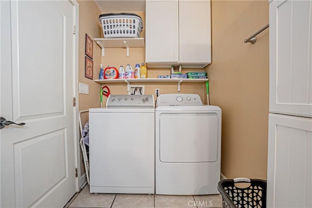 791 W 2nd St, San Pedro, CA 90731 - laundry room featuring independent washer and dryer, cabinet space, and light tile patterned floors