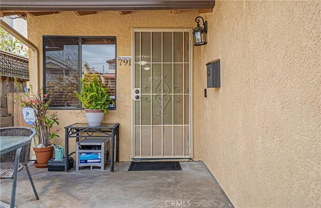 791 W 2nd St, San Pedro, CA 90731 - property entrance with stucco siding and a patio
