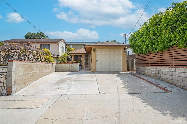 791 W 2nd St, San Pedro, CA 90731 - view of front of house with driveway, a garage, stucco siding, and a gate