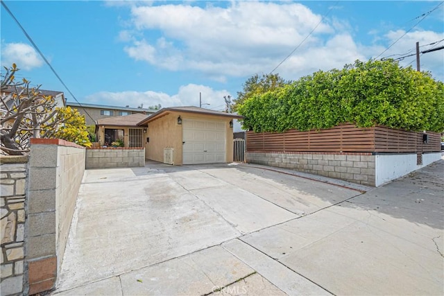 791 W 2nd St, San Pedro, CA 90731 - view of side of property featuring a garage and concrete driveway