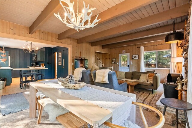 27979 N Bay Rd, Lake Arrowhead, CA 92352 - dining space with stairway, an inviting chandelier, beamed ceiling, and wooden walls