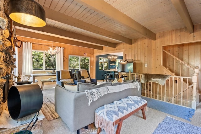 27979 N Bay Rd, Lake Arrowhead, CA 92352 - carpeted living room with beam ceiling, a chandelier, and wooden walls