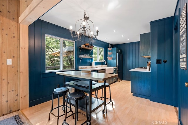 27979 N Bay Rd, Lake Arrowhead, CA 92352 - dining area featuring a chandelier, light wood-style floors, and a healthy amount of sunlight