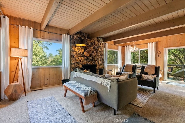 27979 N Bay Rd, Lake Arrowhead, CA 92352 - carpeted living room with wood ceiling, wooden walls, a chandelier, and beamed ceiling