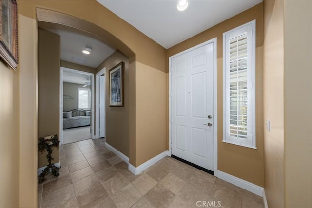 1765 Desert Poppy Ln, Beaumont, CA 92223 - foyer with baseboards and arched walkways