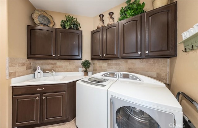 1765 Desert Poppy Ln, Beaumont, CA 92223 - clothes washing area with cabinet space and washing machine and dryer