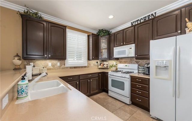 1765 Desert Poppy Ln, Beaumont, CA 92223 - kitchen with white appliances, dark brown cabinets, light countertops, tasteful backsplash, and recessed lighting