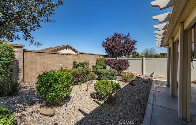 1765 Desert Poppy Ln, Beaumont, CA 92223 - fenced backyard featuring a patio area