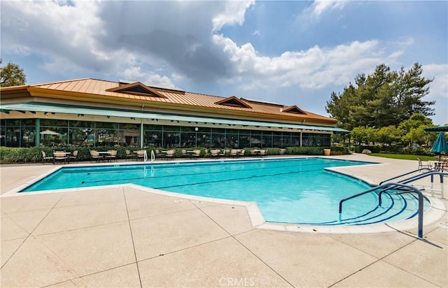 1765 Desert Poppy Ln, Beaumont, CA 92223 - community pool featuring a patio area and fence