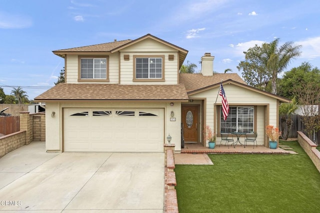 traditional-style house featuring fence, a shingled roof, a front lawn, an attached garage, and driveway