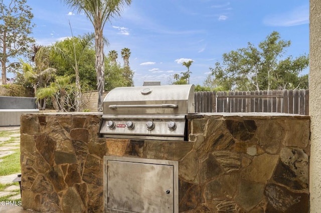 view of patio with fence and area for grilling