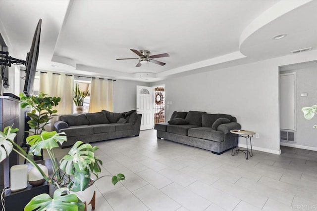 111 69th St, San Diego, CA 92114 - tiled living room featuring a tray ceiling and a ceiling fan