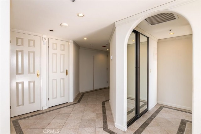 345 Pioneer Dr Unit 1705, Glendale, CA 91203 - hall featuring inlaid floor details, recessed lighting, baseboards, arched walkways, and crown molding