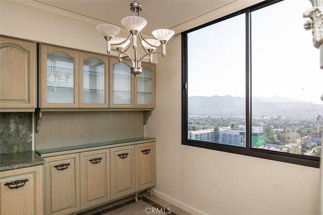 345 Pioneer Dr Unit 1705, Glendale, CA 91203 - kitchen with a mountain view, tasteful backsplash, a chandelier, baseboards, and glass insert cabinets