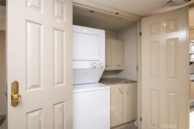 345 Pioneer Dr Unit 1705, Glendale, CA 91203 - laundry room with stacked washer and clothes dryer and cabinet space