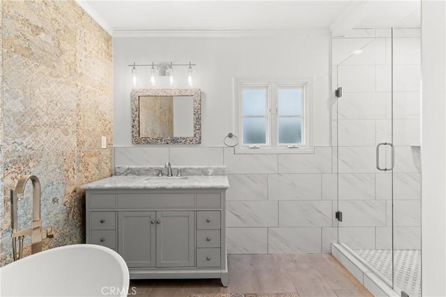 6608 Via Siena, Rancho Palos Verdes, CA 90275 - bathroom featuring ornamental molding, vanity, a shower stall, a soaking tub, and tile walls