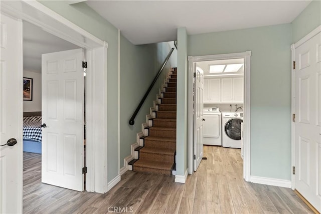 6608 Via Siena, Rancho Palos Verdes, CA 90275 - stairs featuring washer and dryer, wood finished floors, and baseboards