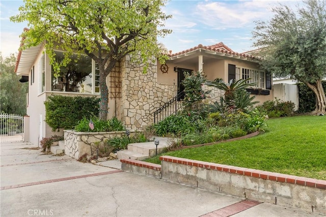 6608 Via Siena, Rancho Palos Verdes, CA 90275 - mediterranean / spanish home featuring stucco siding, stone siding, a tile roof, and a patio