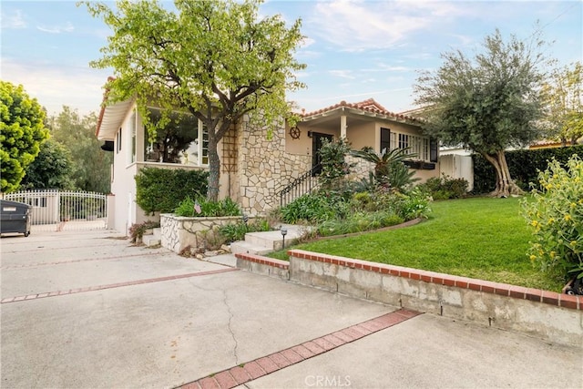 6608 Via Siena, Rancho Palos Verdes, CA 90275 - view of front of house with stone siding, stucco siding, a patio area, and driveway