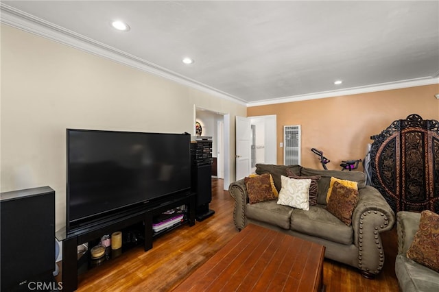 living area with wood finished floors, recessed lighting, and ornamental molding