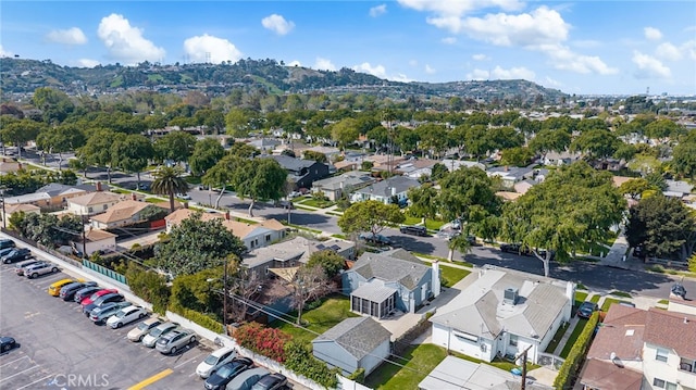drone / aerial view featuring a residential view and a mountain view