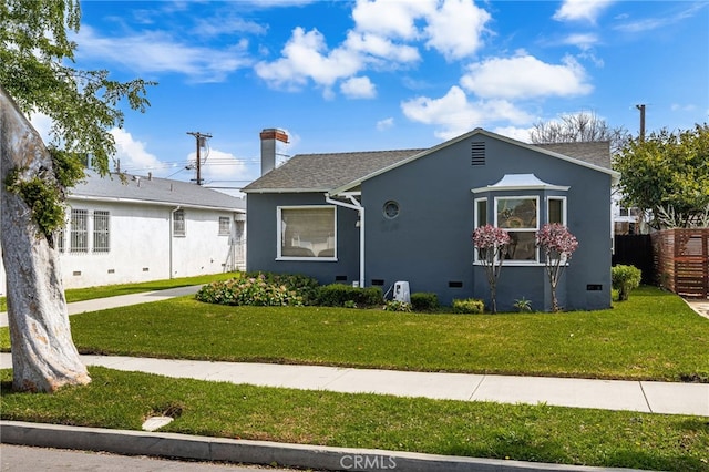 bungalow-style home with stucco siding, crawl space, a front lawn, and fence