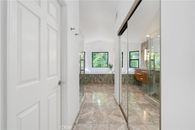 bathroom featuring vanity, a stall shower, marble finish floor, visible vents, and a garden tub